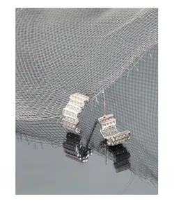 Macro shot of S925 sterling silver stud earrings with multi-row pavé cubic zirconia