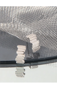 Macro view of C-shaped silver earrings with cubic zirconia stones in geometric step design