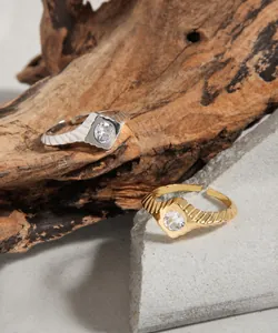 Detailed macro view of S925 silver rings with geometric engraving and zircon stone
