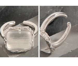 Macro detail of S925 silver ring featuring rectangular crystal and irregular texture