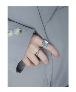 Detail of S925 silver rings with large crystal stone and double-layered beaded design
