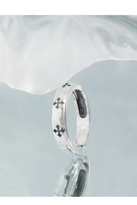 Close-up of S925 sterling silver ring with engraved black cross details and mirror finish