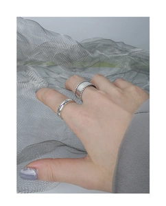 Detail of S925 sterling silver ring set featuring beaded edges and cross pattern engravings