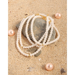 S925 silver multi-layer pearl necklace and bracelet set on natural sand background