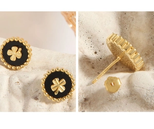 Macro detail of S925 sterling silver stamp and clover design on round earrings
