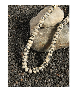 Macro shot of S925 silver beaded necklace with natural spotted marble stone beads
