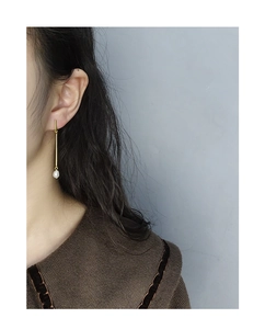 Minimalist S925 silver drop earrings with elegant white pearl on a gold geometric bar