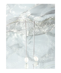 Detailed view of long S925 silver linear drop earrings with elegant white pearl charms