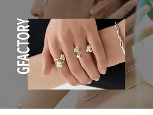 Detail showing lava-style S925 silver liquid rings and wave bracelet on model