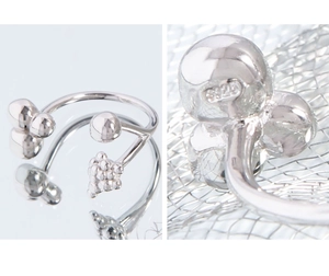 Macro detail of S925 sterling silver stamp on liquid-style geometric beaded ring