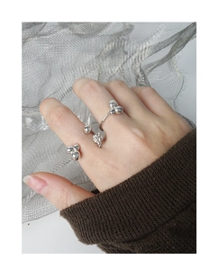 Silver beaded open ring set with grape-like spheres on delicate polished metal bands
