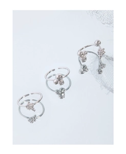 Three-piece silver liquid geometric ring set with bubble texture on blue mirror