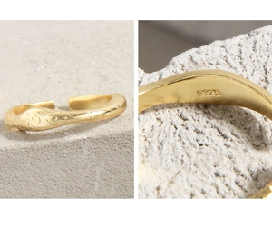 Macro detail of S925 hallmark on matte gold irregular fluid texture sterling silver ring