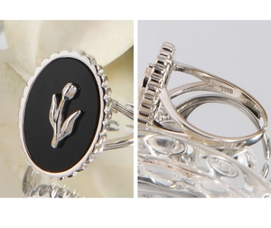 Detailed view of S925 silver ring featuring black agate and tulip relief with S925 stamp