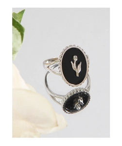 Macro shot of S925 silver tulip ring with black onyx inlay and vintage wavy edges