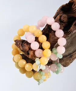 Macro shot of S925 sterling silver stamp on yellow topaz and pink agate beaded bracelet