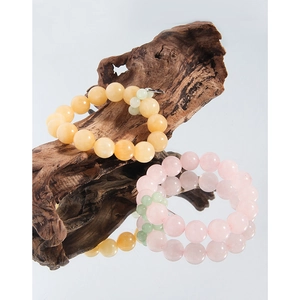 Natural yellow topaz and pink agate S925 silver beaded bracelet on natural wood base