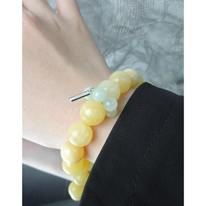 S925 silver bracelet with natural yellow jade beads and green agate on a wrist