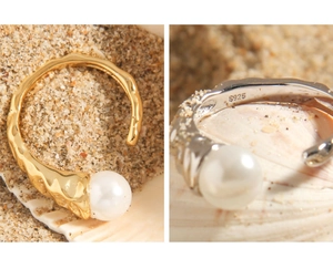 Macro detail of S925 sterling silver stamp on textured lava-style pearl ring band