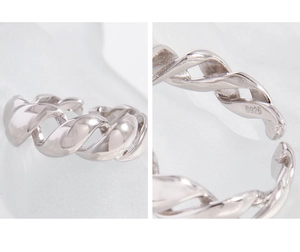 Macro shot of S925 sterling silver twist ring detail showing the authentic hallmark stamp