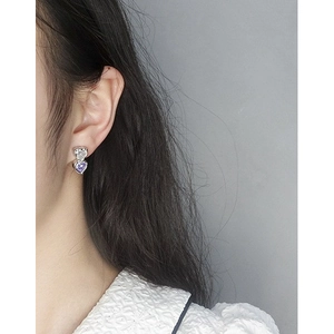 Elegant S925 silver heart earrings with transparent and purple zircons on model