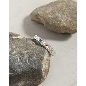 Textured S925 silver ring with colorful cubic zirconia stones on natural stones