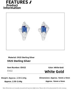 Detailed macro view of S925 sterling silver earrings with blue zircons and wavy texture