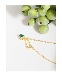Detail of S925 silver necklace with green heart gem and diamond pin pendant