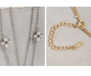 Detail of S925 sterling silver chain with floral pendants and spring clasp fastener