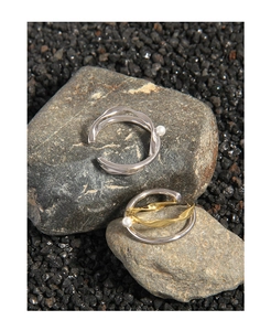 Detail of S925 silver double-layered organic wave rings with delicate pearl accents