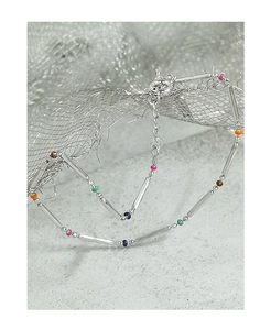Detail of S925 silver rainbow beaded bracelet with colorful charms and bamboo tubes