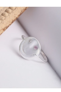 Macro shot of silver smiley face ring featuring pink and white zircon stone inlay