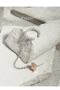 Detail of S925 silver ear cuff with chain and square champagne gemstone stud
