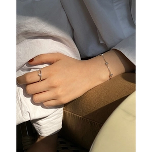 Minimalist S925 sterling silver set featuring a pearl crossover ring and bead bracelet