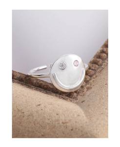 Detail of S925 silver smiley ring with inlaid pink and white zircon stones