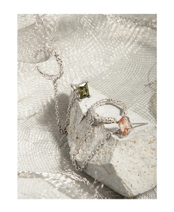 Detail of S925 silver earrings with rectangle gems and irregular hammered texture finish