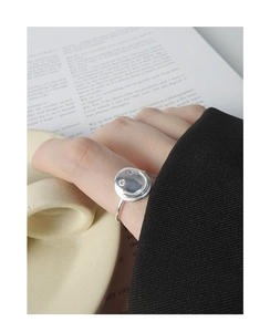 Detail of S925 silver smiley face ring with micro-set pink and clear zircon stones