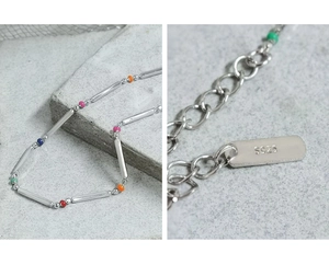 Macro detail of S925 sterling silver rainbow bead necklace with authentic hallmark tag