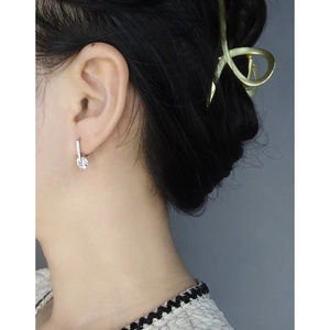 Elegant S925 silver U-shaped hook earrings featuring a large round zircon on female model