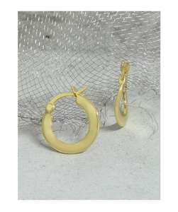 Detailed close-up of wide flat golden hoop earrings with elegant satin finish texture