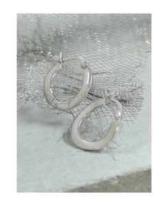 Macro shot of 925 sterling silver hoop earrings with S925 hallmark on mesh background