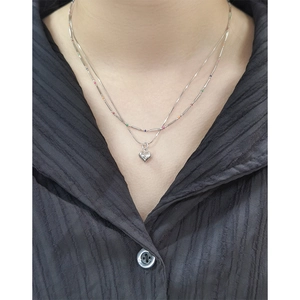 S925 sterling silver layered necklace with rainbow beads and heart pendant on black top