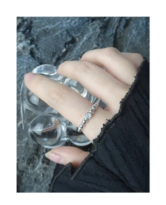 Detail of beaded S925 silver ring with sparkling micro-set cubic zirconia on hand
