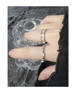 Detailed shot of S925 sterling silver beaded zircon ring and geometric hollow ring band