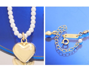 Détail du fermoir S925 et du pendentif cœur sur collier de perles en or poli