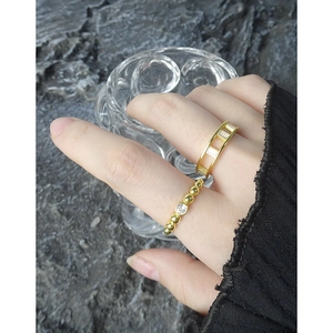 S925 silver ring set with micro-paved cubic zirconia and elegant gold bead design