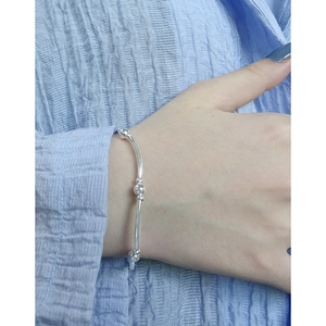 Minimalist S925 sterling silver beaded bracelet for women shown on model wrist