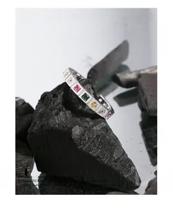 Macro detail of S925 silver ring featuring vibrant multi-color cubic zirconia inlay