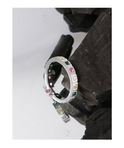 Macro view of S925 silver ring featuring colorful square zircon stones and brushed texture