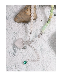 Detail of S925 silver necklace with heart pendant, pearls and green agate beads